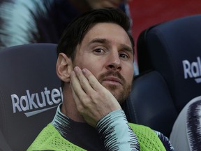 FC Barcelona's Lionel Messi sits on the bench prior of the Spanish La Liga soccer match between FC Barcelona and Athletic Bilbao at the Camp Nou stadium in Barcelona, Spain, Saturday, Sept. 29, 2018.