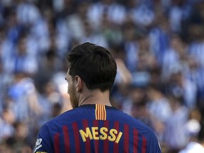 FC Barcelona's Lionel Messi pauses during the Spanish La Liga soccer match between Real Sociedad and FC Barcelona at the Anoeta stadium, in San Sebastian, northern Spain, Saturday, Sept. 15, 2018.