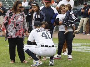 Detroit Tigers designated hitter Victor Martinez hugs a family member before a baseball game Saturday, Sept. 22, 2018, in Detroit. Martinez is playing his final game Saturday and said he wants his final at-bats to be in front of the home fans.
