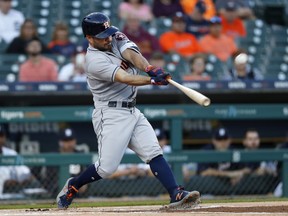 Houston Astros' Jose Altuve hits a leadoff solo home run against the Detroit Tigers in the first inning of a baseball game in Detroit, Tuesday, Sept. 11, 2018.