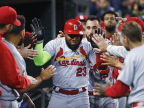 St. Louis Cardinals' Marcell Ozuna (23) celebrates his solo home run in the fourth inning of a baseball game against the Detroit Tigers in Detroit, Friday, Sept. 7, 2018.