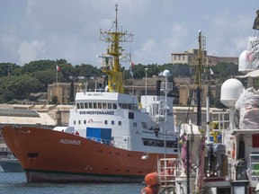 FILE - In a Aug. 15, 2018 file photo, the Aquarius rescue ship enters the harbor of Senglea, Malta. Spain's maritime rescue service said Sunday, Sept. 23, 2018 that it rescued more than 400 people from 15 small boats, most of them off the country's southern coast, while humanitarian groups lamented that the sole private rescue boat operating near the deadly central Mediterranean human trafficking route risked being put out of action by Italy's anti-migrant leaders.