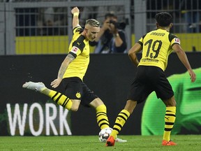 Dortmund's Marius Wolf scores his side's second goal during the German Bundesliga soccer match between Borussia Dortmund and Eintracht Frankfurt in Dortmund, Germany, Friday, Sept. 14, 2018.