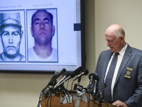 Stearns County Sheriff Don Gudmundson speaks as images of confessed killer Danny Heinrich are shown on a screen during a press release of the investigative files in the Jacob Wetterling case Thursday, Sept. 20, 2018, at the Stearns County Law Enforcement Center in St. Cloud, Minn.