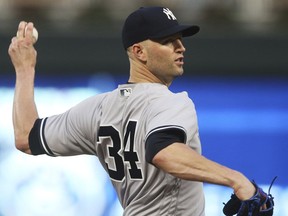 New York Yankees pitcher J.A. Happ throws against the Minnesota Twins in the first inning of a baseball game Monday, Sept. 10, 2018, in Minneapolis.