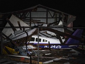 A small plane was ripped from its hangar and flipped by a severe storm at Faribault Municipal Airport earlier Thursday night, Sept. 20, 2018, in Faribault, Minn. Severe storms have hit Minnesota, leaving homes, propane tanks and planes at the municipal airport damaged. The Star Tribune reports that possible tornado touchdowns occurred Thursday in Faribault and Waterville, south of Minneapolis.