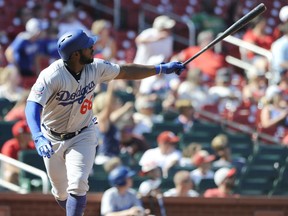 Los Angeles Dodgers' Yasiel Puig (66) watches his third home run of the game a three-run homer against the St. Louis Cardinals in the eighth inning of a baseball game, Saturday, Sept. 15, 2018, at Busch Stadium in St. Louis.
