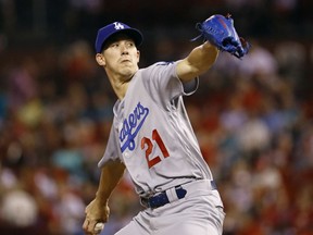 Los Angeles Dodgers starting pitcher Walker Buehler throws during the first inning of a baseball game against the St. Louis Cardinals Friday, Sept. 14, 2018, in St. Louis.