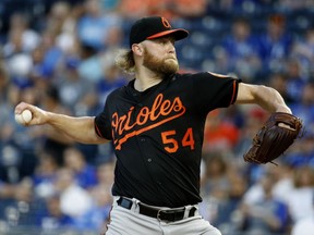 Baltimore Orioles starting pitcher Andrew Cashner throws during the first inning of the team's baseball game against the Kansas City Royals on Friday, Aug. 31, 2018, in Kansas City, Mo.