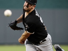 Chicago White Sox starting pitcher Carlos Rodon throws during the first inning of a baseball game against the Kansas City Royals Wednesday, Sept. 12, 2018, in Kansas City, Mo.