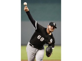 Chicago White Sox starting pitcher Dylan Covey throws during the first inning of a baseball game against the Kansas City Royals Tuesday, Sept. 11, 2018, in Kansas City, Mo.