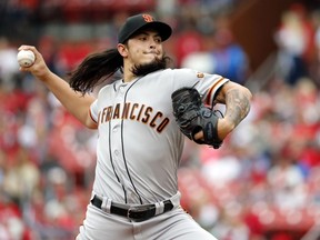 San Francisco Giants starting pitcher Dereck Rodriguez throws during the first inning of a baseball game against the St. Louis Cardinals, Saturday, Sept. 22, 2018, in St. Louis.