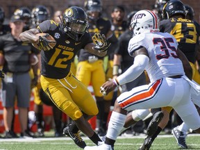 Missouri wide receiver Johnathon Johnson, left, runs past Tennessee-Martin's Kevin Prather Jr., right, during the first half of an NCAA college football game Saturday, Sept. 1, 2018, in Columbia, Mo.