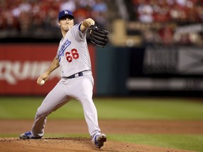 Los Angeles Dodgers starting pitcher Ross Stripling (68) throws during the first inning of a baseball game against the St. Louis Cardinals, Sunday, Sept. 16, 2018 in St. Louis.