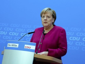 German Chancellor Angela Merkel delivers a statement at the Christian Democratic Union party's headquarters in Berlin, Monday, Sept. 24, 2018.