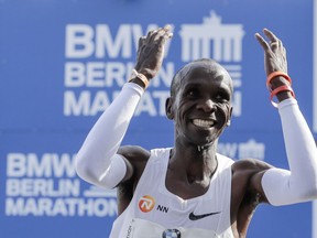 Eliud Kipchoge celebrates winning the 45th Berlin Marathon in Berlin, Germany, Sunday, Sept. 16, 2018. Eliud Kipchoge set a new world record in 2 hours 1 minute 39 seconds.