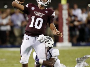 Mississippi State quarterback Keytaon Thompson (10) throws a 27-yard touchdown pass as a Stephen F. Austin defender attempts to tackle him during the first half of their NCAA college football game, Saturday, Sept. 1, 2018, in Starkville, Miss.
