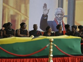 Members of the public pay their respects as the coffin of former U.N. Secretary-General Kofi Annan lies in state at the Accra International Conference Center in Ghana Tuesday, Sept. 11, 2018. Ghanaians are paying their respects to Annan, who died in August in Switzerland at age 80, ahead of Thursday's state funeral.