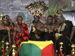 Ghanaian chiefs pay their respects as the coffin of former U.N. Secretary-General Kofi Annan, draped with the Ghana flag, lies in state at the Accra International Conference Center in Ghana Wednesday, Sept. 12, 2018. Ghanaians are paying their respects to Annan, who died in August in Switzerland at age 80, ahead of Thursday's state funeral.