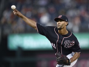 Washington Nationals starting pitcher Joe Ross delivers a pitch during the first inning of the team's baseball game against the New York Mets, Friday, Sept. 21, 2018, in Washington.