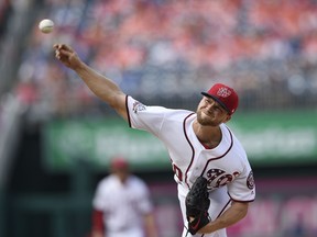 Washington Nationals starting pitcher Austin Voth delivers during the first inning of a baseball game against the New York Mets, Saturday, Sept. 22, 2018, in Washington.