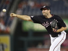 Washington Nationals starting pitcher Max Scherzer delivers a pitch during the first inning of a baseball game against the Miami Marlins, Tuesday, Sept. 25, 2018, in Washington.
