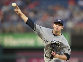 Milwaukee Brewers starting pitcher Chase Anderson delivers a pitch during the first inning of a baseball game against the Washington Nationals, Saturday, Sept. 1, 2018, in Washington.