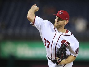 Washington Nationals starting pitcher Stephen Strasburg throws during the first inning of a baseball game against the Miami Marlins in Washington, Monday, Sept. 24, 2018.