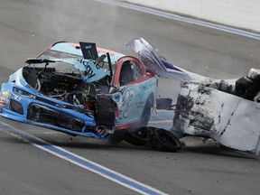 Bubba Wallace crashes in Turn 12 during practice for Sunday's NASCAR Cup Series auto race at Charlotte Motor Speedway in Concord, N.C., Saturday, Sept. 29, 2018.