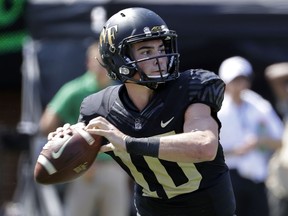 Wake Forest's Sam Hartman (10) looks to pass against Notre Dame in the first half of an NCAA college football game in Winston-Salem, N.C., Saturday, Sept. 22, 2018.