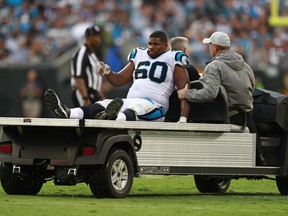 Carolina Panthers' Daryl Williams (60) is taken from the field on a cart after being injured during the second half of an NFL football game against the Dallas Cowboys in Charlotte, N.C., Sunday, Sept. 9, 2018.