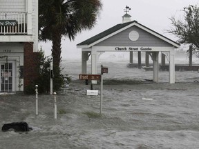 High winds and water surround buildings as Hurricane Florence hits Front Street in downtown Swansboro N.C., Friday, Sept. 14, 2018.