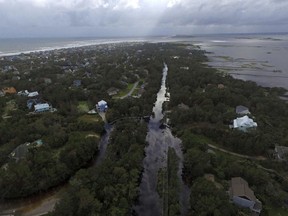 Coast Guard Road leading to the south end of Emerald Isle is seen after Hurricane Florence hit Emerald Isle, N.C., Sunday, Sept. 16, 2018.