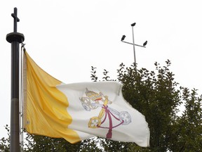 In this Aug. 28, 2018 photo, turkey vultures rest on the cross atop the Cathedral of The Risen Christ adjacent to the Catholic Chancery in Lincoln, Neb. The Diocese of Lincoln housed at the complex, that refused for years to participate in annual sex abuse audits is facing a potential criminal investigation and criticism that it mishandled priests who were accused of sexual assault and morally questionable behavior.