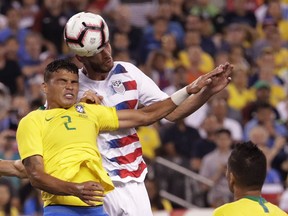 Brazil defender Thiago Silva, left, goes up for the ball against United States defender Matt Miazga during the first half of an international soccer friendly match, Friday, Sept. 7, 2018, in East Rutherford, N.J.