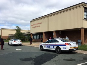Worried parents rushed to a St. John's high school this morning after as many as 20 students were hit with a harsh spray irritant during an altercation. Royal Newfoundland Constabulary attend to a scene at Prince of Wales Collegiate high school, in St. John's on Wednesday, Sept. 19, 2018.