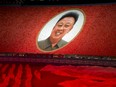 A portrait of late North Korean leader Kim Jong Il is formed during the "Glorious Country" mass games held in conjunction with the 70th anniversary of North Korea's founding day in Pyongyang, North Korea, Sunday, Sept. 9, 2018.