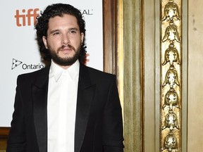Actor Kit Harrington poses for photographs on the red carpet after arriving for the new movie "The Death and Life of John F. Donovan" during the 2018 Toronto International Film Festival in Toronto on Monday, September 10, 2018.