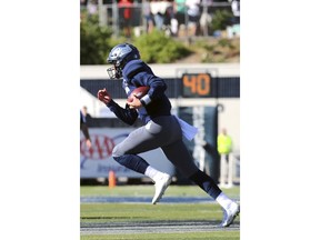 Nevada starting quarterback Ty Gangi (6) runs for a first down against Oregon State during an NCAA college football game, Saturday, Sept. 15, 2018, in Reno, Nev.