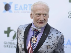 FILE - In this Feb. 28, 2018 file photo, Buzz Aldrin attends the 15th annual Global Green Pre-Oscar Gala, at NeueHouse Hollywood in Los Angeles. Aldrin on Wednesday, Sept. 12 tweeted "Goodnight Moon!" He wrote he's still "thinking about you" and called his time on the lunar surface the "best bouncy house ever."  The 88-year-old was the lunar module pilot when he and mission commander Neil Armstrong landed on the moon on July 21, 1969 during the Apollo 11 mission.