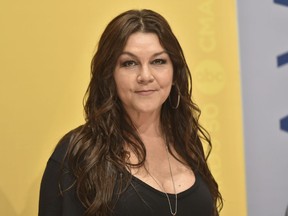 FILE - In this Nov. 2, 2016 file photo, Gretchen Wilson arrives at the 50th annual CMA Awards at the Bridgestone Arena in Nashville, Tenn. Wilson has agreed to donate $500 to charity to settle a criminal charge related to a disturbance at a Connecticut airport last month. The Grammy-winning "Redneck Woman" singer appeared Thursday, Sept. 13, 2018  in court in Enfield. A misdemeanor breach of peace charge will be dismissed based on the donation to a fund for injured crime victims.