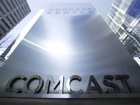 FILE -This March 29, 2017 file photo shows a sign outside the Comcast Center in Philadelphia.  British regulator says Comcast has won an auction to formally bid for broadcaster Sky, on Saturday, Sept. 22, 2018.