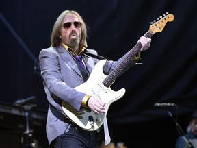 FILE - In this  Saturday, June 24, 2017 file photo, Tom Petty performs with the Heartbreakers during their headlining set on Day 1 of the inaugural 2017 Arroyo Seco Music Festival, in Pasadena, Calif. Tom Petty's family and former band members say it like therapy to compile a four-disc box set of his music. It went on sale Friday, Sept. 28, 2018 four days short of the first anniversary of his death.