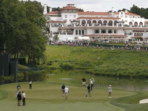 FILE - In this June 14, 2011, file photo, golfers practice on the 18th green of the Congressional Country Club during a practice round for the U.S. Open Championship golf tournament in Bethesda, Md. The PGA of America is bringing six of its biggest championships to Congressional over the next 18 years, including the Ryder Cup.