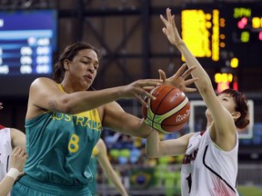 FILE - In this Aug. 11, 2016, file photo, Australia center Liz Cambage (8) reaches for a rebound in front of Japan guard Sanae Motokawa during the first half of a women's basketball game at the Summer Olympics in Rio de Janeiro, Brazil. Cambage is averaging a FIBA Women's Basketball World Cup-best 25.8 points a game while only playing 20.4 minutes.