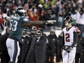 FILE - In this Jan. 13, 2018, file photo, Atlanta Falcons' Matt Ryan and Philadelphia Eagles' Nigel Bradham react after Atlanta cannot score on fourth and goal during the second half of an NFL divisional playoff football game, in Philadelphia. The Eagles have a tough opponent Thursday night in the NFL opener. The Atlanta Falcons were 2 yards away from knocking the Eagles out of the playoffs in the divisional round but Matt Ryan's pass to Julio Jones fell incomplete in the right corner of the end zone.