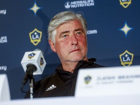 FILE - In this March 30, 2018, file photo, LA Galaxy's head coach Sigi Schmid is shown during a press conference in Carson, Calif. Schmid, the winningest coach in Major League Soccer history who led the LA Galaxy to the first of five MLS Cup titles, has stepped down as coach of the Galaxy. The team said Schmid's resignation was effective immediately Monday, Sept. 10, 2018. Dominic Kinnear was named the interim head coach for the remainder of the season.