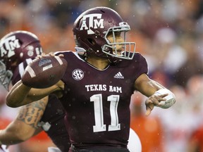 FILE - In this Sept. 8, 2018, file photo, Texas A&M quarterback Kellen Mond (11) passes down field against Clemson during the first half of an NCAA college football game, in College Station, Texas. Mond turned heads by throwing for a career-high 430 yards as the Aggies came just short of knocking off Clemson last week.