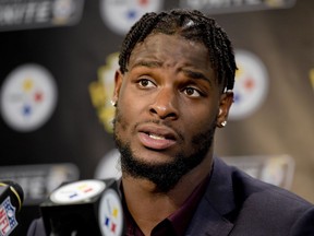 FILE - In this Oct. 22, 2017, file photo, Pittsburgh Steelers running back Le'Veon Bell (26) answers questions at a post-game meeting with reporters following a 29-14 win over the Cincinnati Bengals in an NFL football game in Pittsburgh. The Steelers are beginning preparations for their Week 1 opener against Cleveland without All-Pro running back Le'Veon Bell. Bell did not arrive at the team's facility in time for practice on Monday and has yet to sign his one-year franchise tender, leaving his status for Sunday's visit to the Browns in doubt.