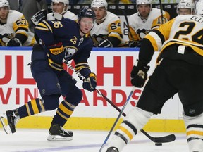 FILE - In this Sept. 18, 2018, file photo, Buffalo Sabres defenseman Rasmus Dahlin (26) brings the puck into the Pittsburgh Penguins zone during the third period of an NHL preseason hockey game,in Buffalo N.Y. Dahlin has already created a buzz in Buffalo with his smooth-skating and heads-up play-making abilities.